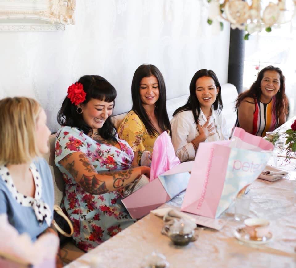 Elegant high tea baby shower setup by Aimee Provence, featuring themed decorations, fine china, and delicate pastries.